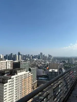 a view of a city from the top of a building at Entire Condo loft in Mandaluyong in Manila