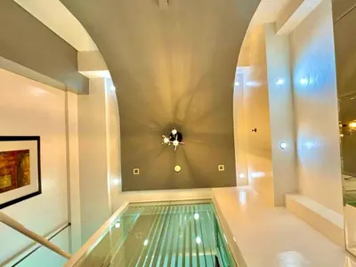 a swimming pool in a room with a ceiling at Entire Condo loft in Mandaluyong in Manila