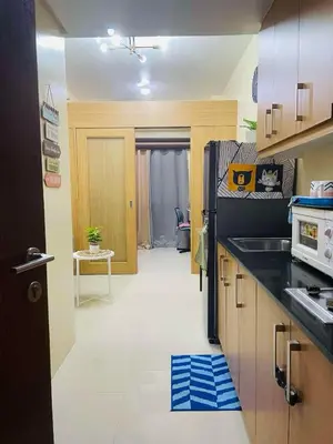 a kitchen with a sink and a counter top at Shell Residences Near Moa and Naia Airport- Rhoi in Manila