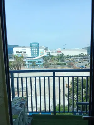 a view of the beach from a hotel room balcony at Sea Residences david in Manila