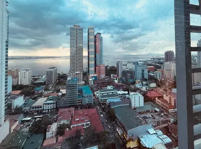 a view of a city with tall buildings at Condo in Ermita near UP-PGH, St Lukes & US Embassy in Manila