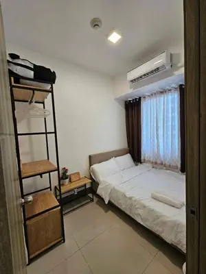 a bedroom with a bunk bed and a ladder at KakaI's Staycation in Fame in Manila
