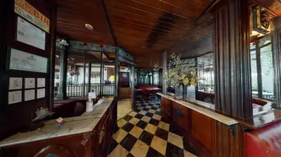 a train car with a checkered floor in a room at Adriatico Arms Hotel in Manila
