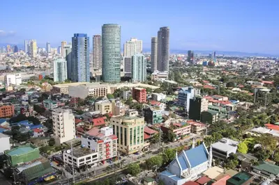 an aerial view of a city with tall buildings at The Henry Suites MiraNila Quezon City in Manila