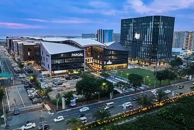 a city with buildings and a street with cars at Sybaysuites staycation near Okada COD MOA NAIA in Manila
