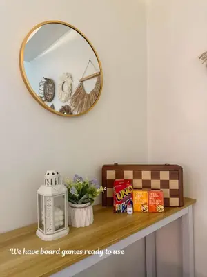 a mirror sitting on top of a table with a shelf at ElcaPri Staycation - Shore 2 Residences in Manila