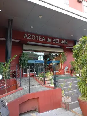 a building with a sign that reads akoteega de bellair at Nikki's cozy home makati in Manila