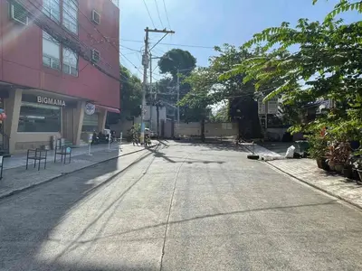 an empty street in the middle of a city at Nikki's cozy home makati in Manila