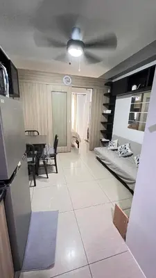 a living room with a couch and a table at STARR 2050 Vacation Home in Manila