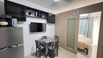 a small kitchen with a table in a room at STARR 2050 Vacation Home in Manila