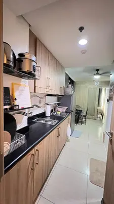 a kitchen with a sink and a counter top at STARR 2050 Vacation Home in Manila