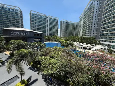 a view of a resort with a pool and buildings at AZURE BICUTAN BORACAY 4FL BEACH POOL View in Manila
