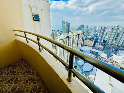 a balcony of a building with a view of the city at Birch Tower A8 Front of Robinson Mla BayFree Pool in Manila