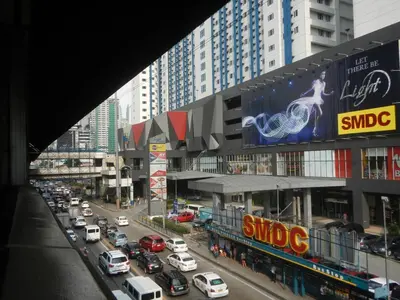 a busy city street filled with lots of traffic at 1BR Condotel with Balcony at SM Light Residences #LT03-1 in Manila