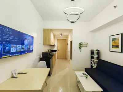 a living room with a couch and a table at 1BR Condotel with Balcony at SM Light Residences #LT05-1 in Manila