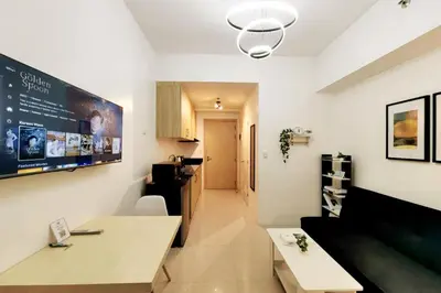 a room with a kitchen and a living room at 1BR Condotel with Balcony at SM Light Residences #LT05-1 in Manila