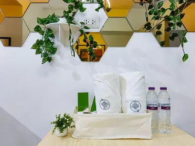 a table with two bottles of water and plants at 1BR Condotel with Balcony at SM Light Residences #LT06-1 in Manila