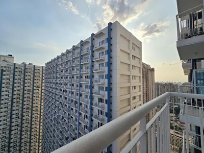 a view of a tall building from a balcony at 1BR Condotel with Balcony at SM Light Residences #LT07-1 in Manila