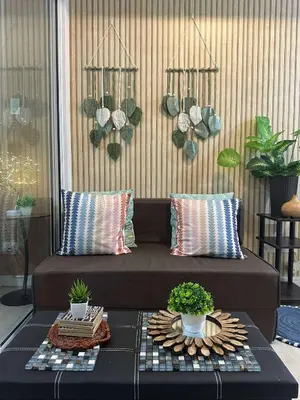 a couch in a room with potted plants on a table at AZURE BICUTAN-MAUI 1631 City View in Manila