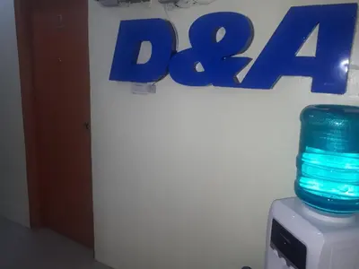 a blue glass jar sitting on top of a computer at D and A Transient Inn Taguig in Taguig