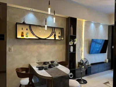 a kitchen with a table and chairs and a television at Landscape view and sea view 1BR near Airport in Manila