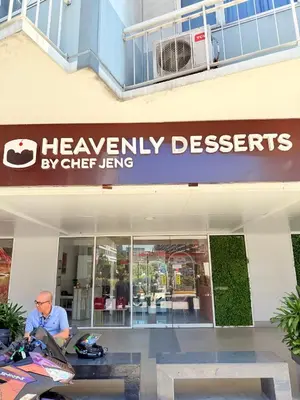 a man standing in front of a healinyl deserts store at Shell Residences MOA Prime - Paul in Manila