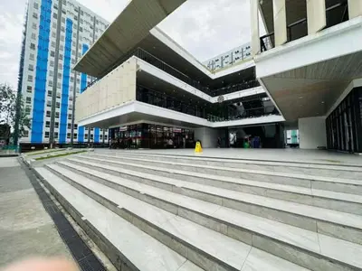 a large building with stairs in front of it at Angels Pad in Manila