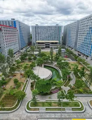 a large city with tall buildings and a park at Angels Pad in Manila