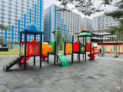 a group of playground equipment in a park at Angels Pad in Manila