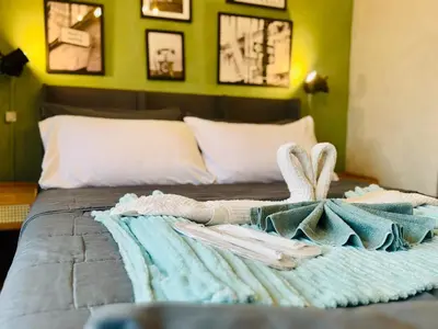a bedroom with a bed with a towel on it at Netflix and WiFi Staycation Viceroy Walk to Venice Grand Canal in Manila