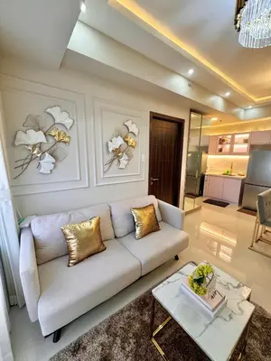 a living room with a couch and a table at Manila Bay Suite near PICC in Manila