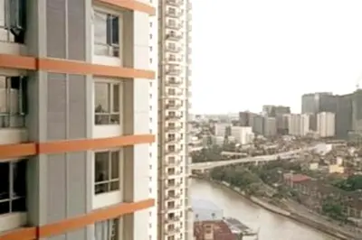 a view of a river from a building at Cozy Condo near BGC and Ortigas with free Gym & Pool in Manila