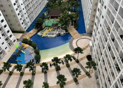 an aerial view of a water park in a city at MOA staycation located in Shore1 and 2 Residences Pasay City in Manila