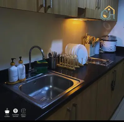 a kitchen counter with a sink in a kitchen at MOA Condotel in Mall of Asia located in Shore1 and 2 Residences in Manila