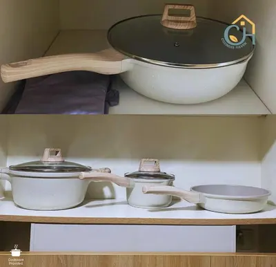 two bowls and a pan sitting on a shelf at MOA Condotel in Mall of Asia located in Shore1 and 2 Residences in Manila