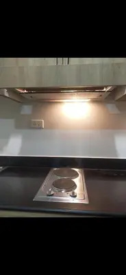 a stove in an oven with a light on it at Mall of Asia Condohotel located in Shore Residences Pasay in Manila