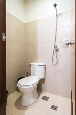 a bathroom with a toilet and a shower at Florence Mc Kinley Spacious 2 Bedroom, 2 balcony nr Mall, T3 airport in Manila