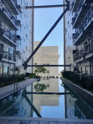 a view of a pool in the middle of a building at Elevated cozy loft studio in Manila