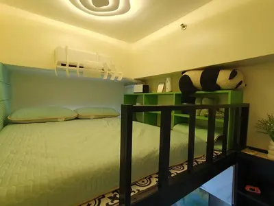 a bedroom with a bunk bed with at Elevated cozy loft studio in Manila