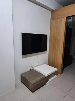 a room with a flat screen tv on a wall at 1BR with Netflix in Shell Residences Pasay in Manila