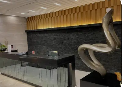 a sculpture of a snake sitting on a table in a lobby at Apartment in Pasay, close to Mall Of Asia in Manila