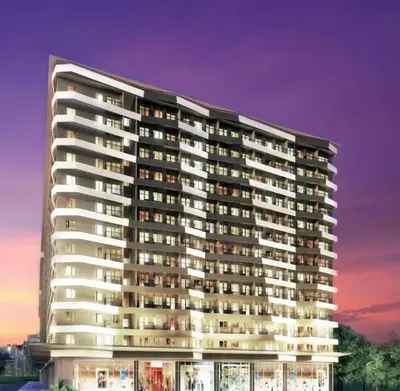 a rendering of a large apartment building at dusk at Apartment in Pasay, close to Mall Of Asia in Manila