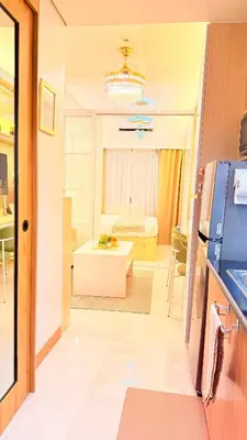 a room with a kitchen and a living room at Goldleaf Suite at Red Residences with Balcony in Prime Makati Location in Manila