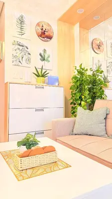 a living room with a couch and a table at Goldleaf Suite at Red Residences with Balcony in Prime Makati Location in Manila