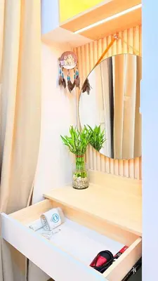 a shelf with a mirror and a potted plant at Goldleaf Suite at Red Residences with Balcony in Prime Makati Location in Manila