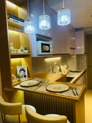 a kitchen with a counter with two plates on it at Shore Urban Escape in Manila