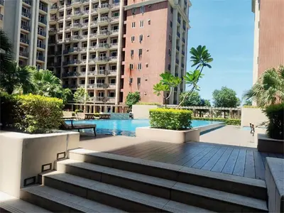a swimming pool in the middle of a building at BP1637 Facing Pool with Balcony near MOA BP1637 in Manila