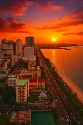 an aerial view of a city with a sunset at Spacious 3BR near US Embassy, Manila Ocean Park in Manila