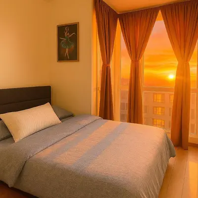 a bedroom with a bed and a window with a sunset at Lovely 1BR w Sunset near Solaire, Okada, Airport in Manila