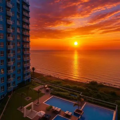 a sunset over the ocean from a building at Elegant 1BR near Solaire, Okada, Mall of Asia in Manila